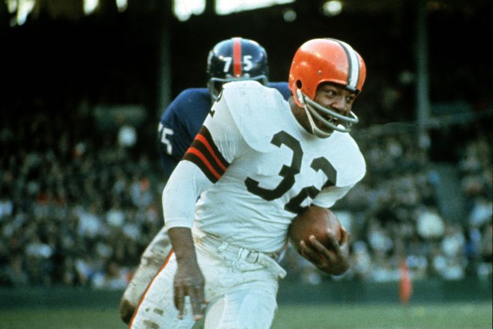 FILE - Jimmy Brown (32), running back for the Cleveland Browns, is shown in action against the New York Giants in Cleveland, Ohio, on Nov. 14, 1965. NFL legend, actor and social activist Jim Brown passed away peacefully in his Los Angeles home on Thursday night, May 18, 2023, with his wife, Monique, by his side, according to a spokeswoman for Brown's family. He was 87. (AP Photo/File)