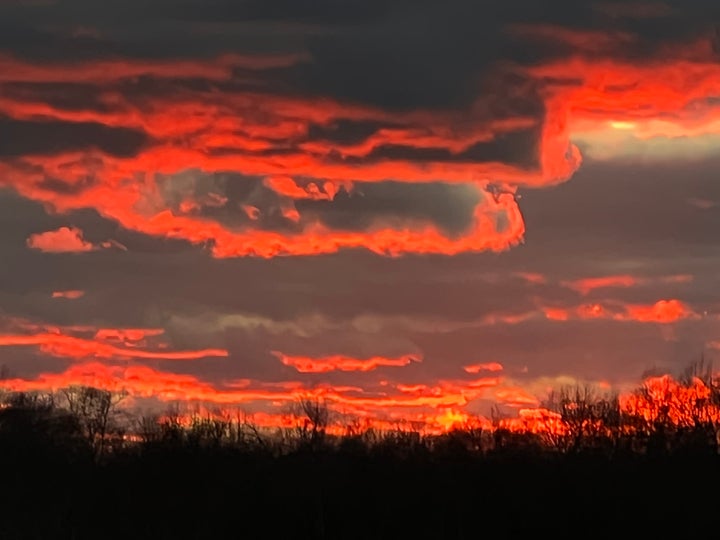 The sunset over the author's meadow in 2022.