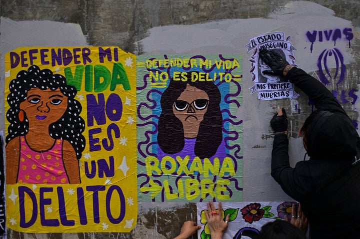 An activist takes part in a protest in support of Roxana Ruiz Santiago after she was accused of homicide.