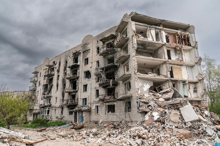 View of residential apartment building destroyed by air strikes in Kharkiv region of Ukraine.