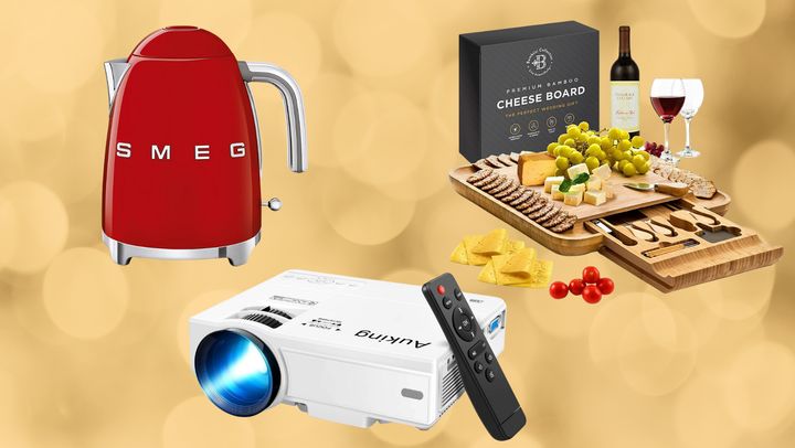 A Smeg tea kettle, portable projector and cheese and charcuterie board.