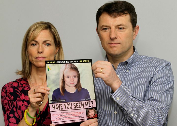 Kate and Gerry McCann pose for the media with a missing poster depicting an age progression computer generated image of their still missing daughter Madeleine during a news conference in London, May 2, 2012.