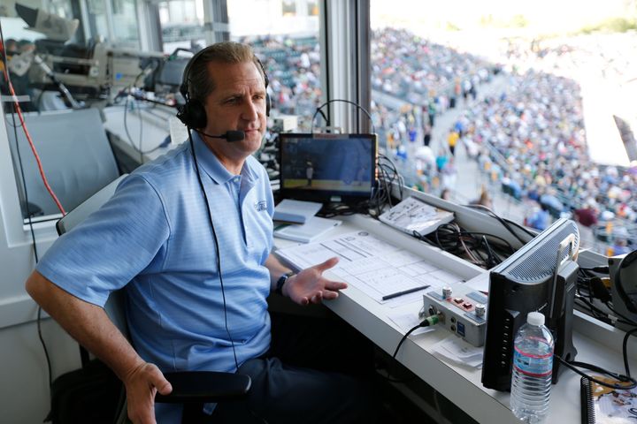 Broadcaster Glen Kuiper Jr. works from the press box during a game against the Chicago White Sox at Hohokam Stadium on March 8, 2015, in Mesa, Arizona.