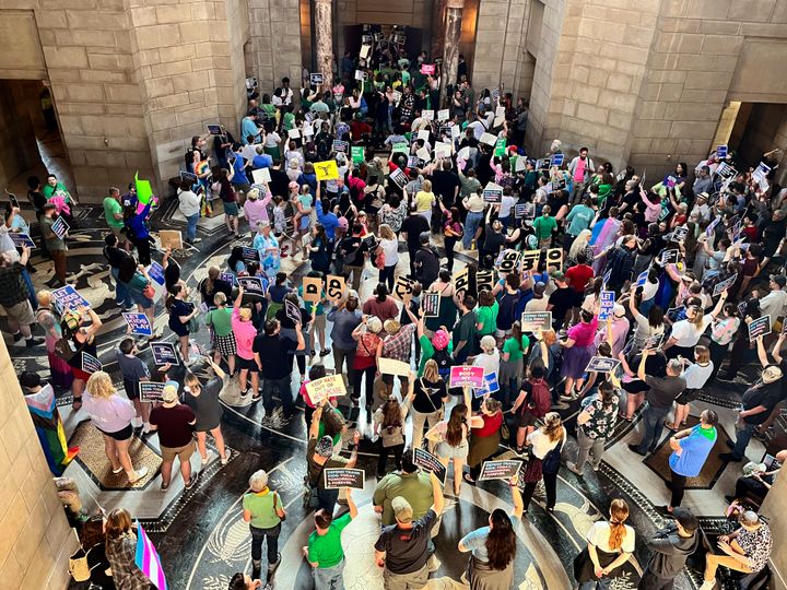 Hundreds of people descended on the Nebraska Capitol on May 16 to protest adding the abortion ban to the transgender health care bill. 