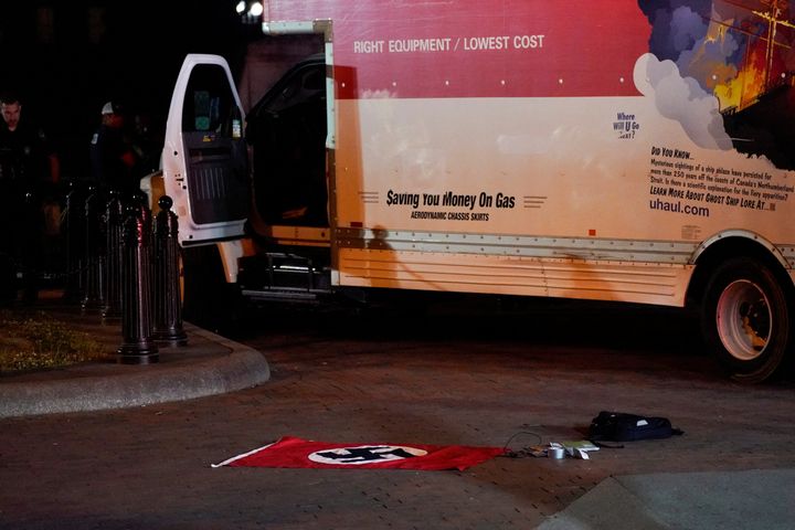 A Nazi flag and other objects recovered from a rented box truck are pictured on the ground as the U.S. Secret Service and other law enforcement agencies investigate the truck that crashed into security barriers at Lafayette Park across from the White House in Washington, D.C. on May 23, 2023.
