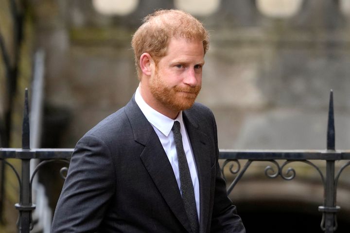 Prince Harry has said he doesn’t feel safe visiting Britain with his young children, and has cited aggressive press photographers.