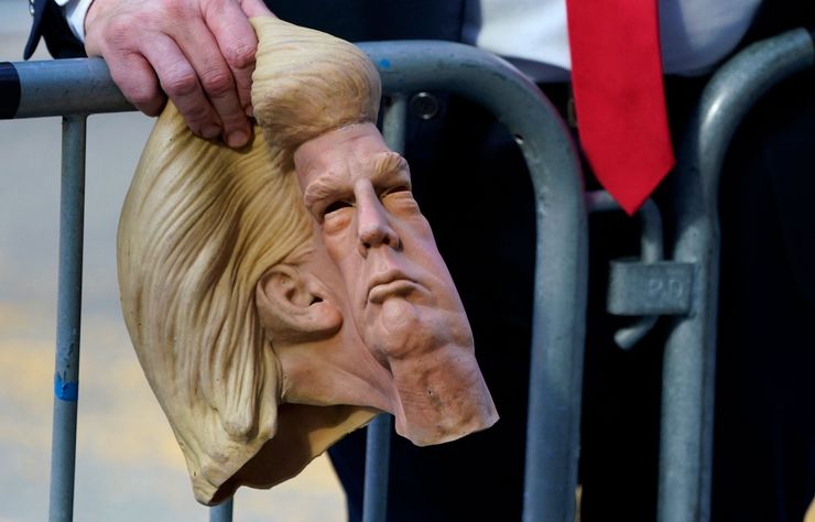 Donald Trump impersonator Neil Greenfield waits outside Trump Tower in New York on April 12 as crowds gather to see the former president, who was returning to New York City to prepare for a deposition in the Manhattan offices of New York state Attorney General Letitia James.