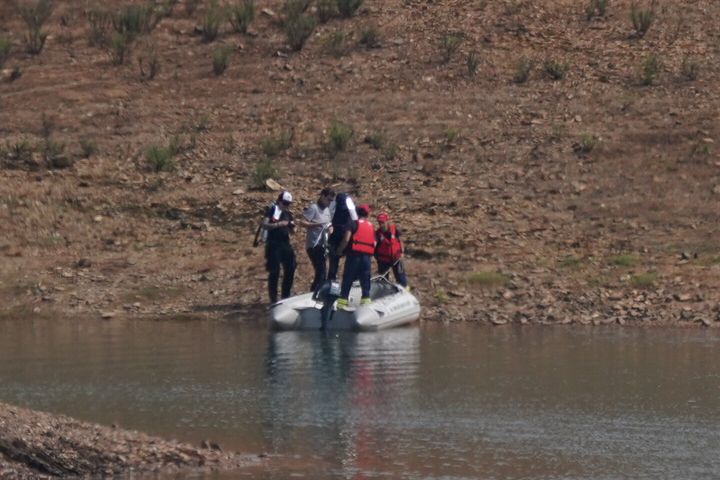 Personnel at Barragem do Arade reservoir in Portugal, as searches begin as part of the investigation into the disappearance of Madeleine McCann. 