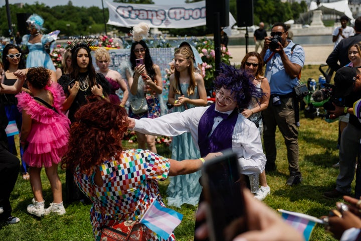 Simon Garbett, 17, who hails from Little Rock, Arkansas, dances with his mom Lizz Garbett during the Trans Youth Prom on May 22 in Washington, D.C.