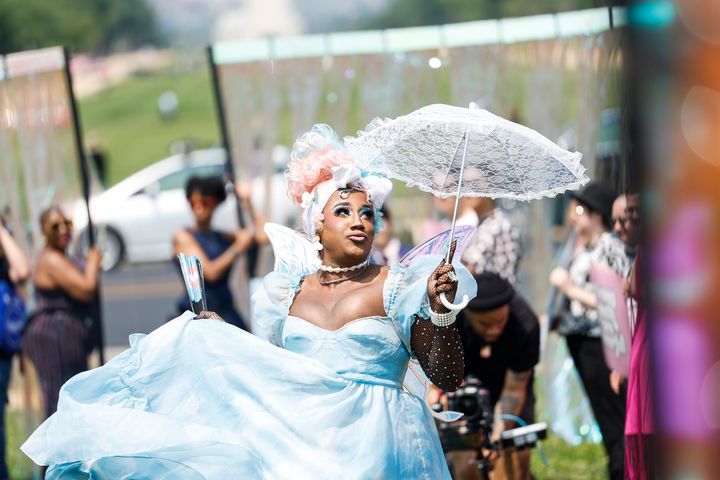 Drag Performer Stormie Daie performs past rows of adults and family members before the arrival of trans and nonbinary kids at the Trans Youth Prom on May 22.