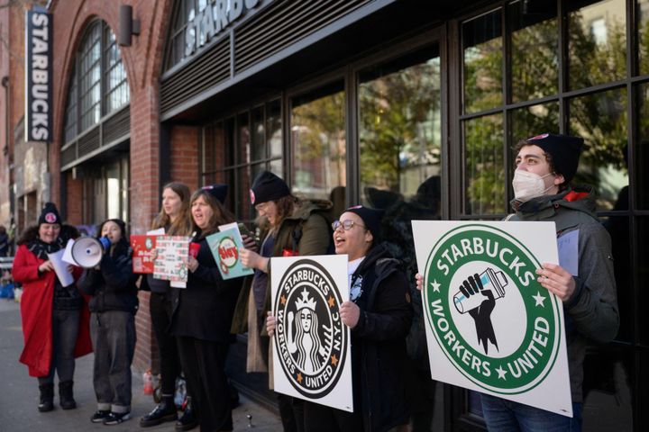 Starbucks workers strike outside a shop in Brooklyn on November 17, 2022.