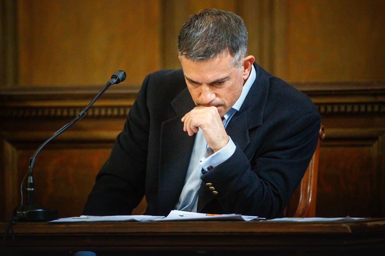 Fotis Dulos examines a financial document during a civil case in Hartford Superior Court in Hartford, Connecticut, on Dec. 4, 2019. 