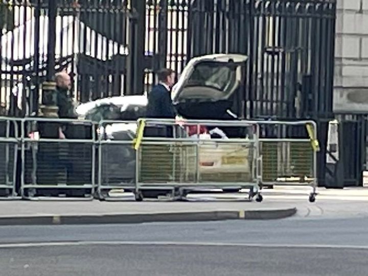 Police at the scene after a car collided with the gates of Downing Street in London.