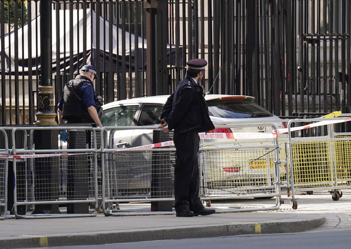 Police at the scene after a car collided with the gates of Downing Street in London. The Metropolitan Police said armed officers have arrested a man on suspicion of criminal damage and dangerous driving. Picture date: Thursday May 25, 2023. (Photo by James Manning/PA Images via Getty Images)