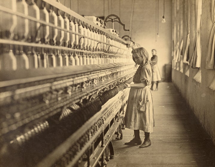 A young girl works in a South Carolina cotton mill in 1908. Photographs such as this one helped convince the American public of the need for child labor laws in the early 20th century.