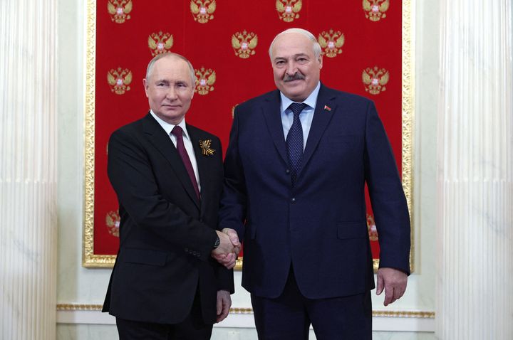 Russian President Vladimir Putin greets Belarus' President Alexander Lukashenko at the Kremlin prior to the Victory Day military parade in central Moscow on May 9, 2023.