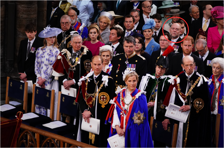 Tindall is pictured within the red circle at the coronation, where he was seated behind Prince Harry. 