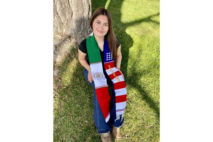 In this undated photo, Naomi Peña Villasano poses with a sash of both the Mexican and American flags. A federal judge sided with the district, finding that “the School District could freely permit one sash and prohibit another.”