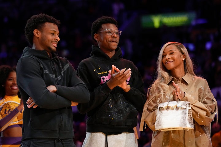 Bronnie, Bryce and Savannah James (left to right) appear at a ceremony honoring LeBron James as the NBA's all-time leading scorer.  9 in Los Angeles.