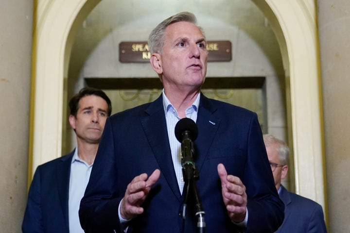 House Speaker Kevin McCarthy of Calif., speaks during a news conference after President Joe Biden and McCarthy reached an "agreement in principle" to resolve the looming debt crisis on Saturday, May 27, 2023, on Capitol Hill in Washington. Rep. Patrick McHenry, R-N.C., back right, and Rep. Garret Graves, R-La., left, listen. (AP Photo/Patrick Semansky)