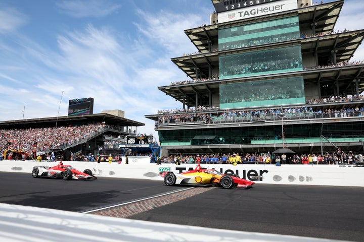 Josef Newgarden crosses the finish ahead of Marcus Ericsson, driver of the #8 Huski Chocolate Chip Ganassi Racing Honda. (Photo by Justin Casterline/Getty Images)