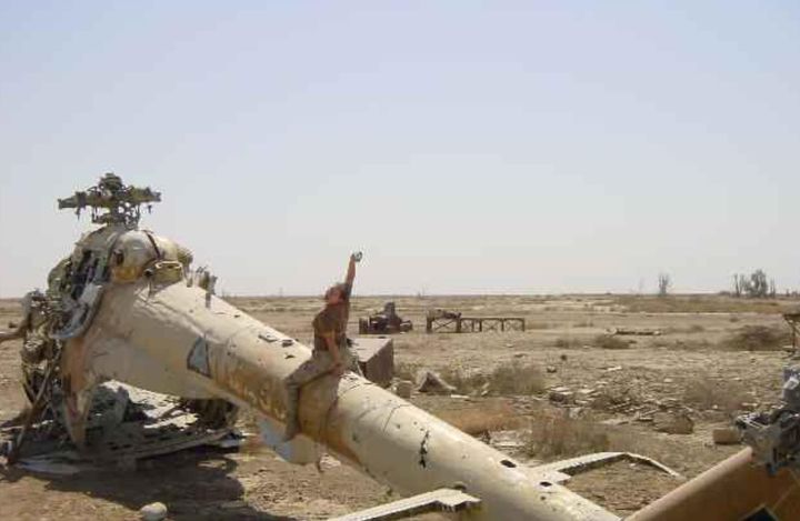 The author in an aircraft graveyard on Talill Air Base in Iraq (2003).