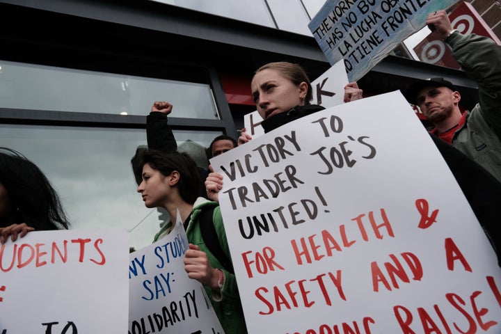 Pro-union workers rally outside a Trader Joe's in Manhattan. Trader Joe's United has unionized four stores since last year.