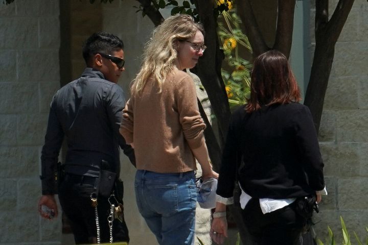 Theranos founder Elizabeth Holmes arrives to begin serving her prison sentence at the Federal Prison Camp in Bryan, Texas.