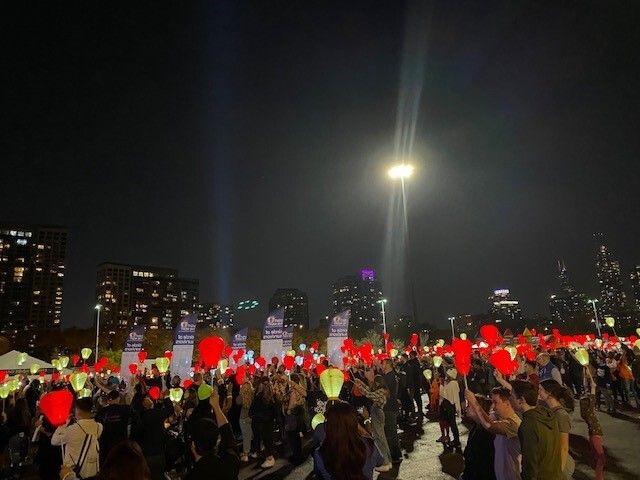 People gathered with lanterns at a Light the Night event