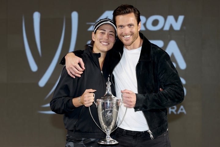 Muguruza and Borges after she beat Anett Kontaveit at the Women's Singles Finals in 2021.