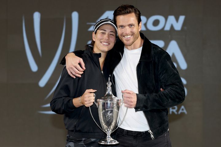 Muguruza and Borges after she beat Anett Kontaveit at the Women's Singles Finals in 2021.