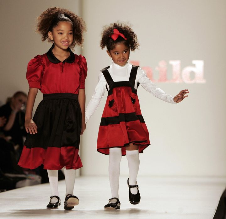 Ming Lee Simmons and Aoki Lee Simmons, children of Russell and Kimora Lee Simmons, walk during fashion week in February 2007 in New York City.
