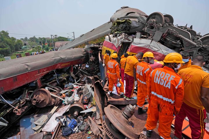 Rescuers work at the site of passenger trains that derailed in Balasore district, in the eastern Indian state of Orissa, Saturday, June 3, 2023. Rescuers are wading through piles of debris and wreckage to pull out bodies and free people after two passenger trains derailed in India, killing more than 280 people and injuring hundreds as rail cars were flipped over and mangled in one of the country’s deadliest train crashes in decades. (AP Photo/Rafiq Maqbool)