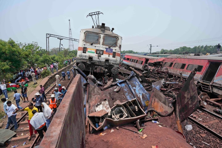 Rescuers work at the site of passenger trains that derailed in Balasore district, in the eastern Indian state of Orissa, Saturday, June 3, 2023. Rescuers are wading through piles of debris and wreckage to pull out bodies and free people after two passenger trains derailed in India, killing more than 280 people and injuring hundreds as rail cars were flipped over and mangled in one of the country’s deadliest train crashes in decades. (AP Photo/Rafiq Maqbool)