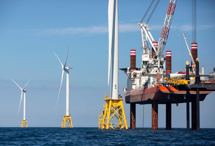 A lift boat that serves as a work platform assembles a wind turbine off Block Island, Rhode Island, in August 2016. President Joe Biden's energy goals require a lot more wind farms like the one off Block Island.