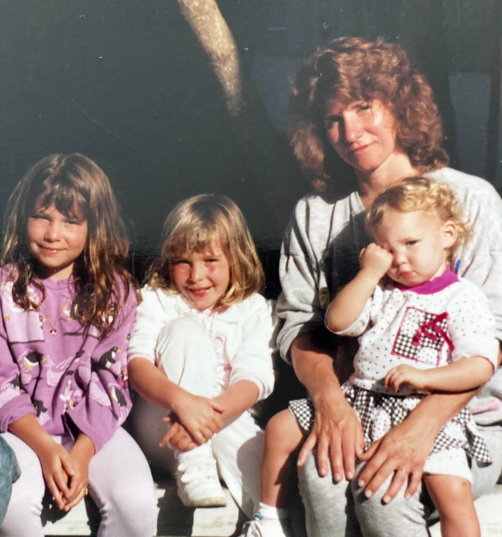 The author poses with her three daughters at Disney circa 1991.