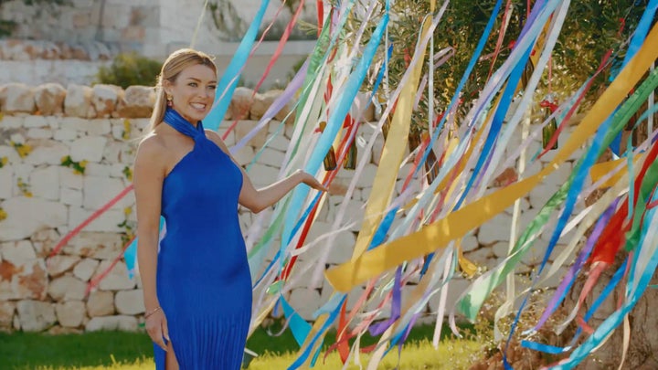 Dannii Minogue in front of the "big gay olive tree of truth"