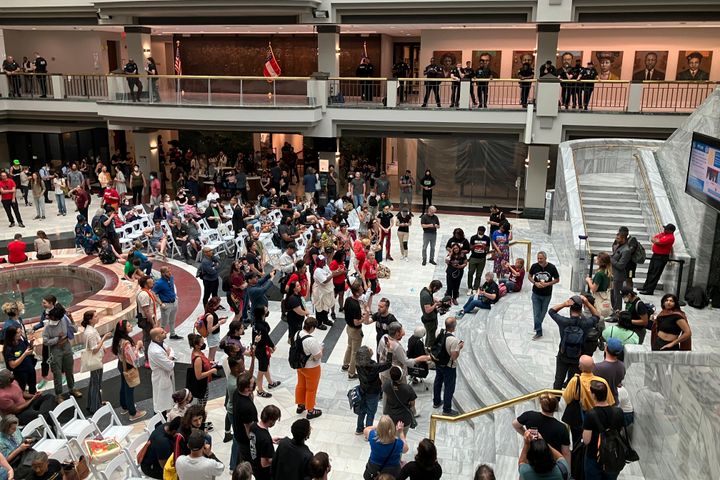Hundreds of people gather in Atlanta's City Hall on June 5, 2023, to speak ahead of a council vote that approved tens of millions in public funding for the construction of a proposed police and firefighter training center that activists decry as "Cop City."