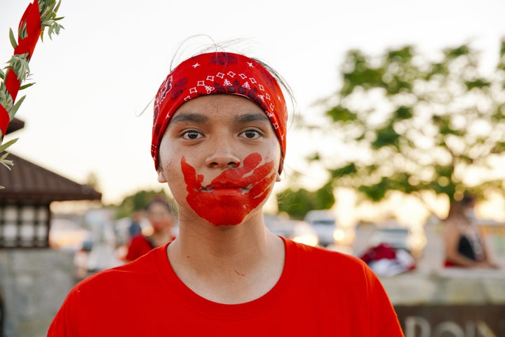 An Arizona community activist appears with the imprint of a bloody hand across her mouth, an attempt to bring attention to the soaring numbers of Indigenous women who are murdered and missing in the U.S. At least some of these women are believed to have been pulled into human trafficking operations.