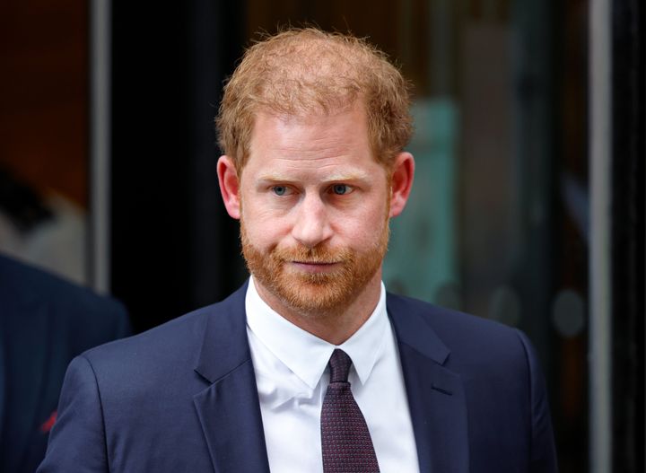 Prince Harry departs the Rolls Building of the High Court after giving evidence during the Mirror Group phone hacking trial.