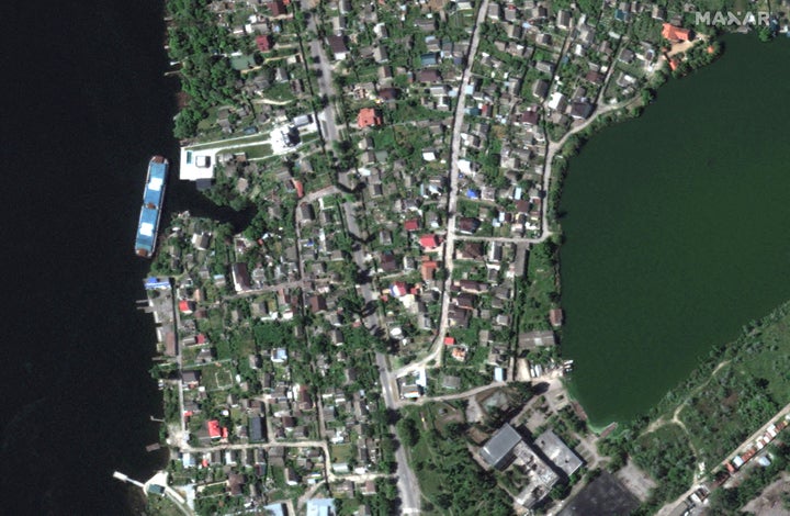 A satellite image shows a view before homes were flooded along Dnipro River southeast of Kherson, Ukraine, May 15, 2023.