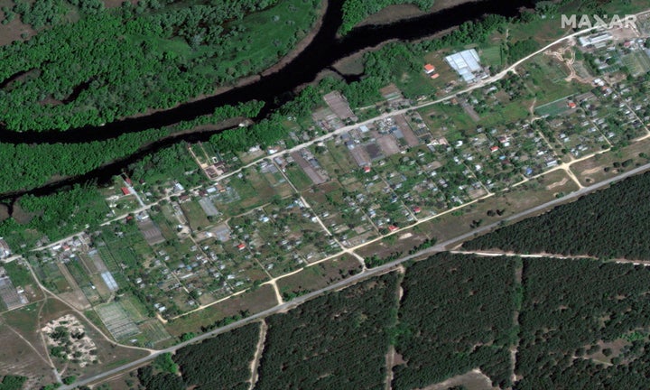 A satellite image shows homes in Krynky, Ukraine, before flooding – May 15, 2023.