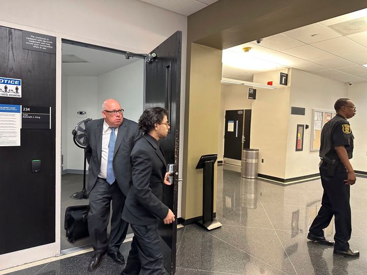 Al-Hassan Aiyash, center, leaves a court with his attorney Ben Gonek on Tuesday, June 6, 2023, in Detroit, Michigan. A judge ordered Aiyash to trial on an involuntary manslaughter charge. (AP Photo/Ed White)