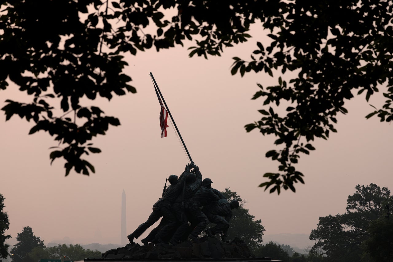 Hazy skies caused by Canadian wildfires cover the monuments and skyline of Washington, DC as seen from Arlington, Virginia on Wednesday.