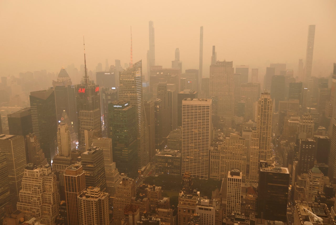 Heavy smoke blankets buildings around Times Square in a view looking north from the Empire State Building as the sun sets on Tuesday in New York City.