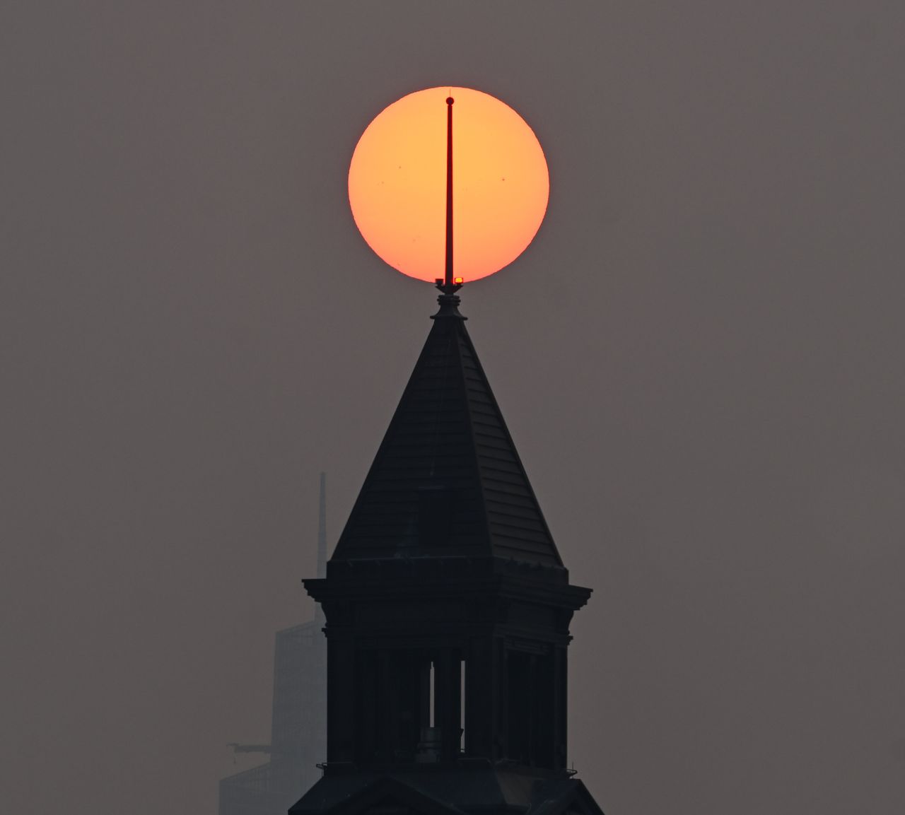The sun as it rises in a hazy, smoky sky in New York City on Wednesday.