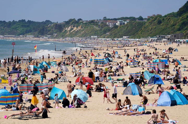 <strong>People enjoying the warm weather at Bournemouth beach in Dorset.</strong>