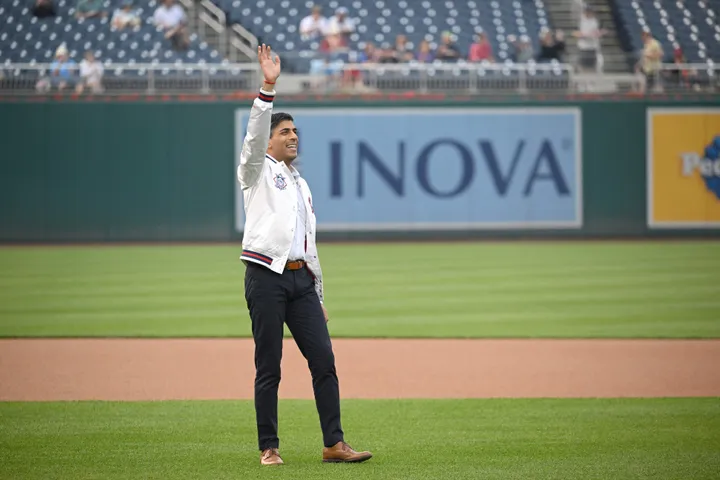 British Prime Minister Rishi Sunak poses with Washington Nationals mascot  Screech as he attends a Washington Nationals baseball game during his  visit to Washington, Wednesday, June 7, 2023. (Kevin Lamarque/Pool Photo via