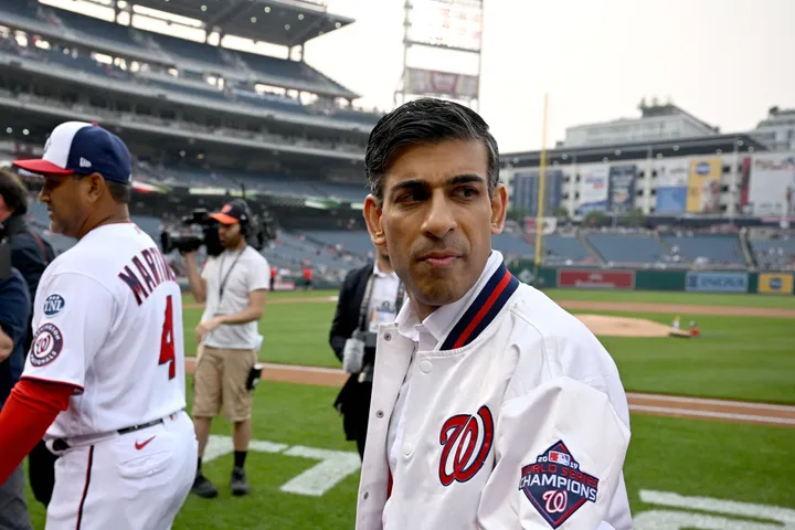 British Prime Minister Rishi Sunak poses with Washington Nationals mascot  Screech as he attends a Washington Nationals baseball game during his  visit to Washington, Wednesday, June 7, 2023. (Kevin Lamarque/Pool Photo via