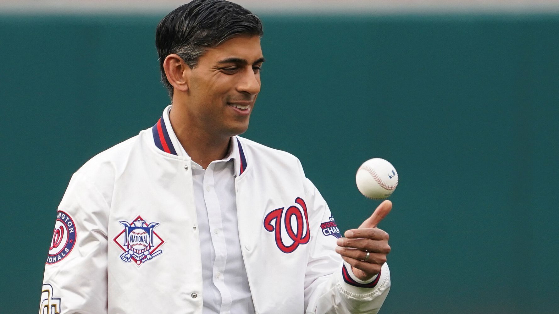 British Prime Minister Rishi Sunak poses with Washington Nationals mascot  Screech as he attends a Washington Nationals baseball game during his  visit to Washington, Wednesday, June 7, 2023. (Kevin Lamarque/Pool Photo via